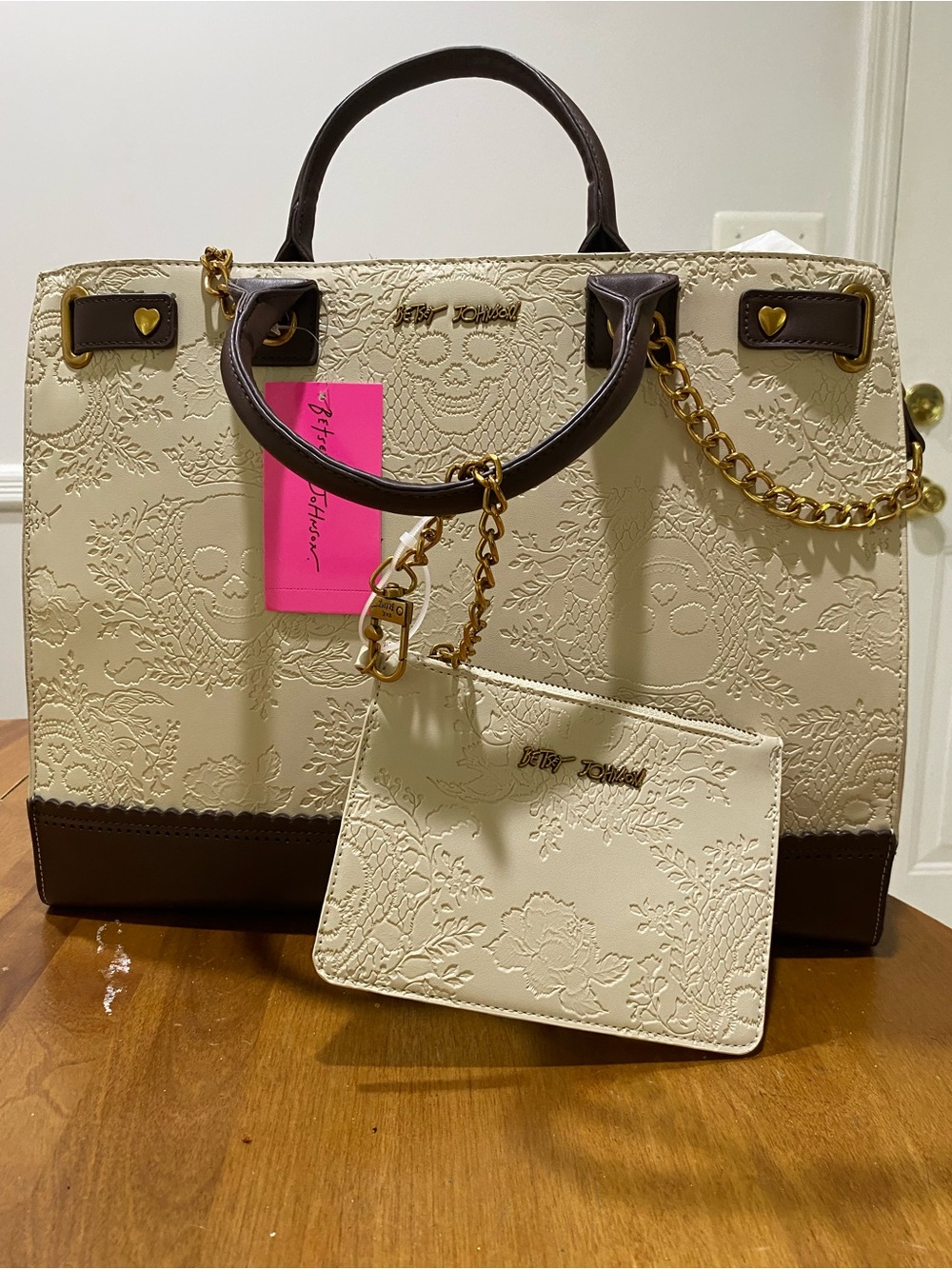 NWOT.  Betsey Johnson, cream/brown tote with skulls.